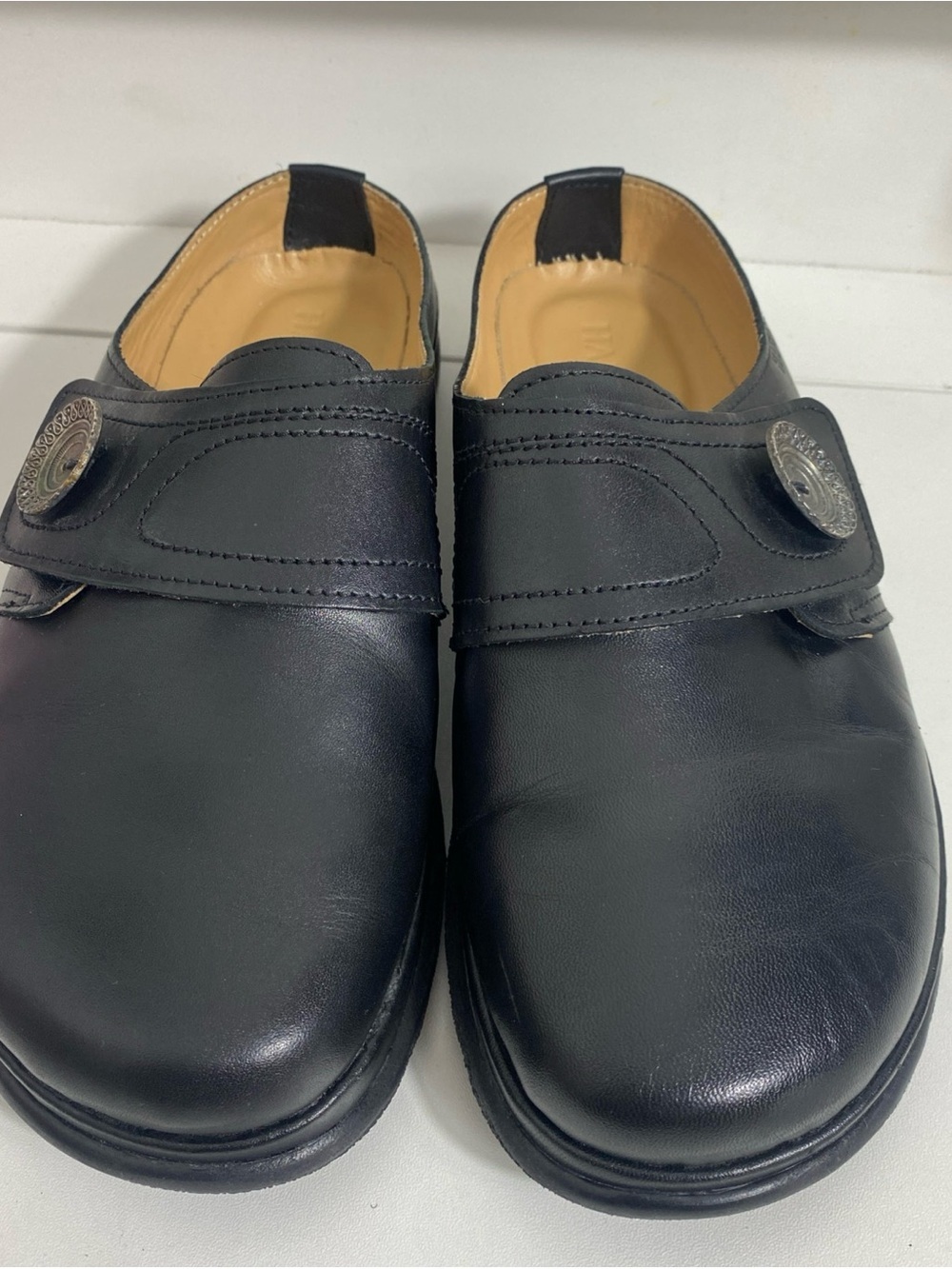 Haflinger Black Slip-On Loafers with Silver Medallion